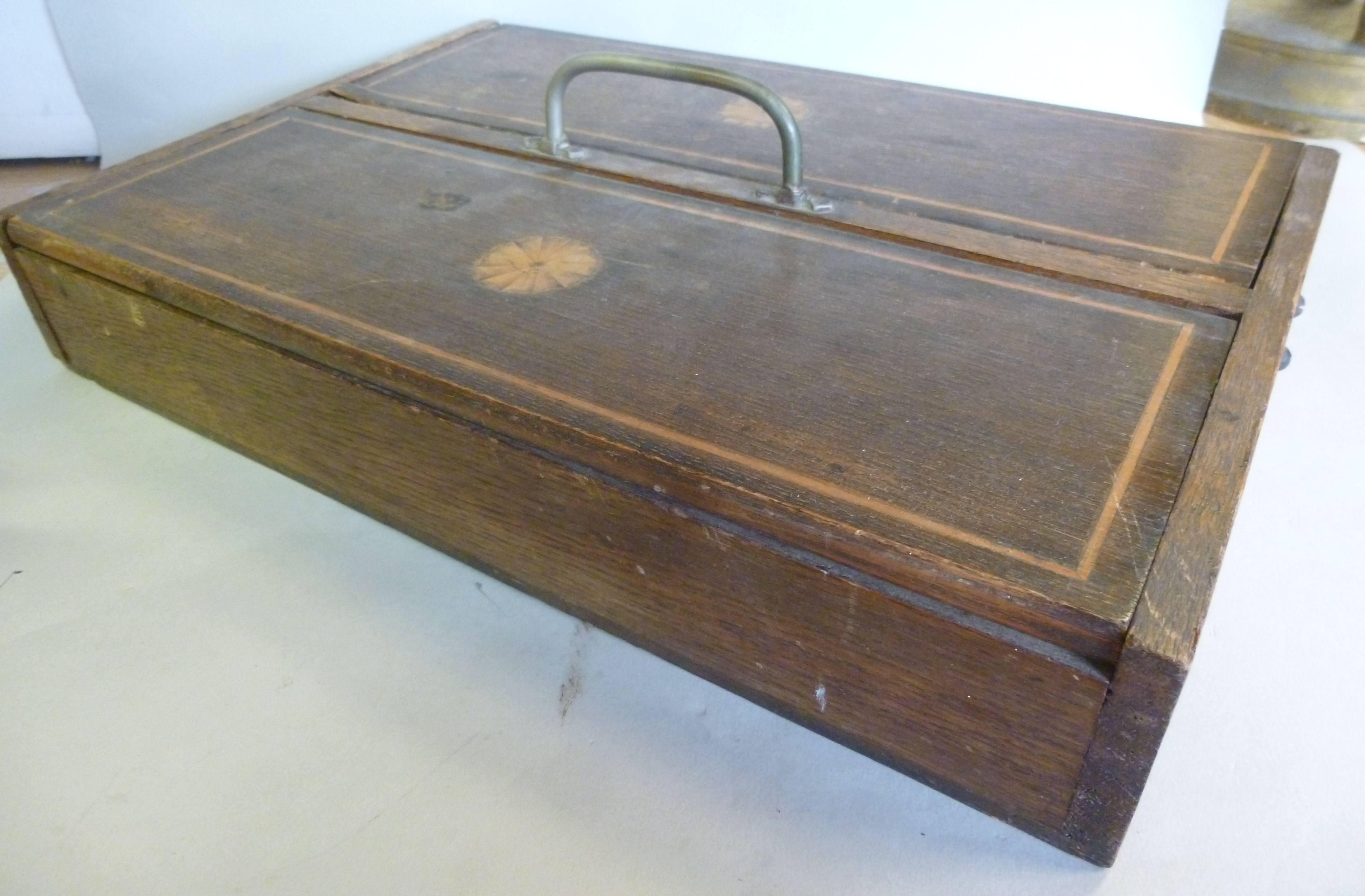 A late 19thC oak cutlery box, the two ri