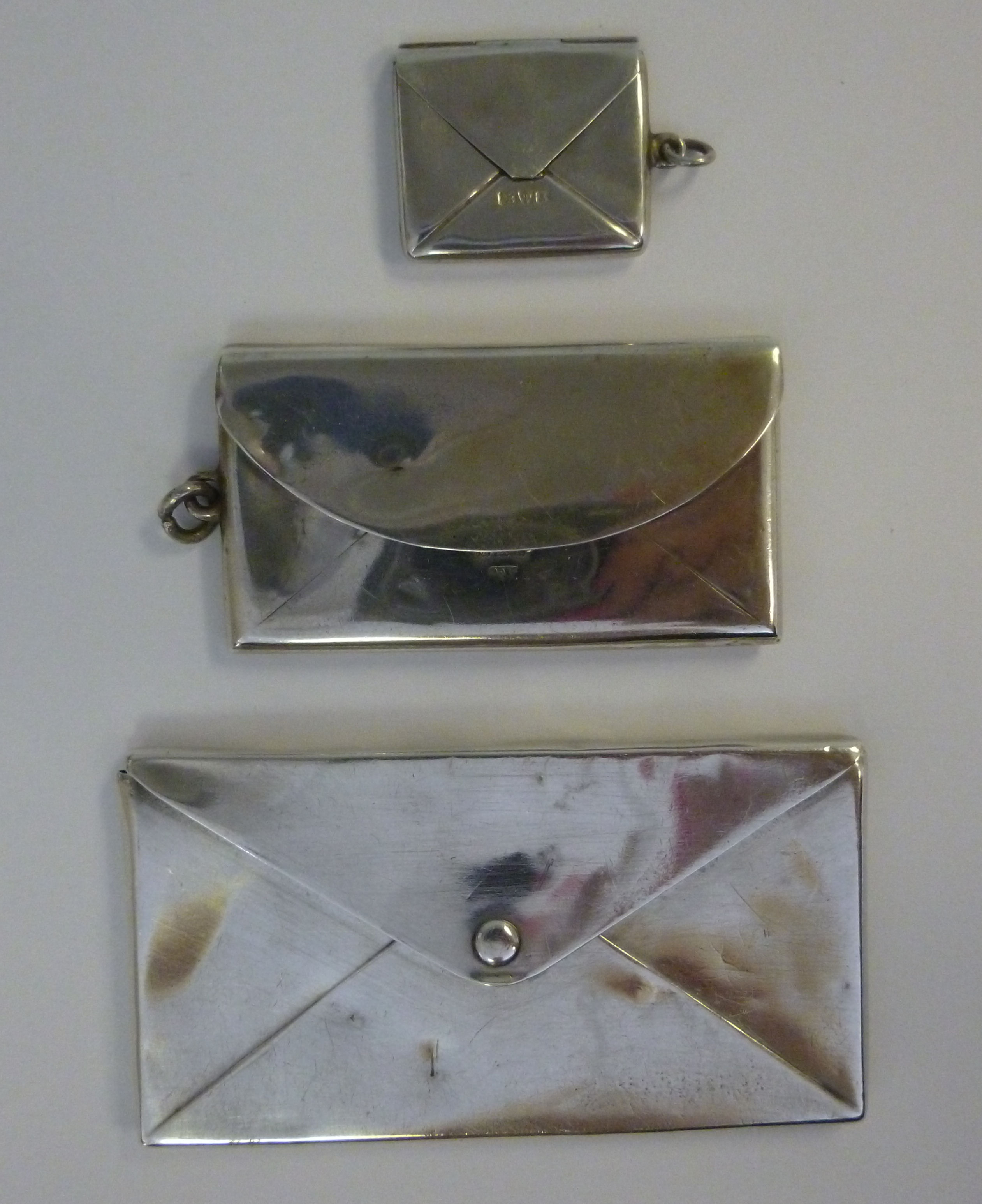 Three similar, early 20thC silver, envel