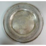 A silver coloured metal plate, having a