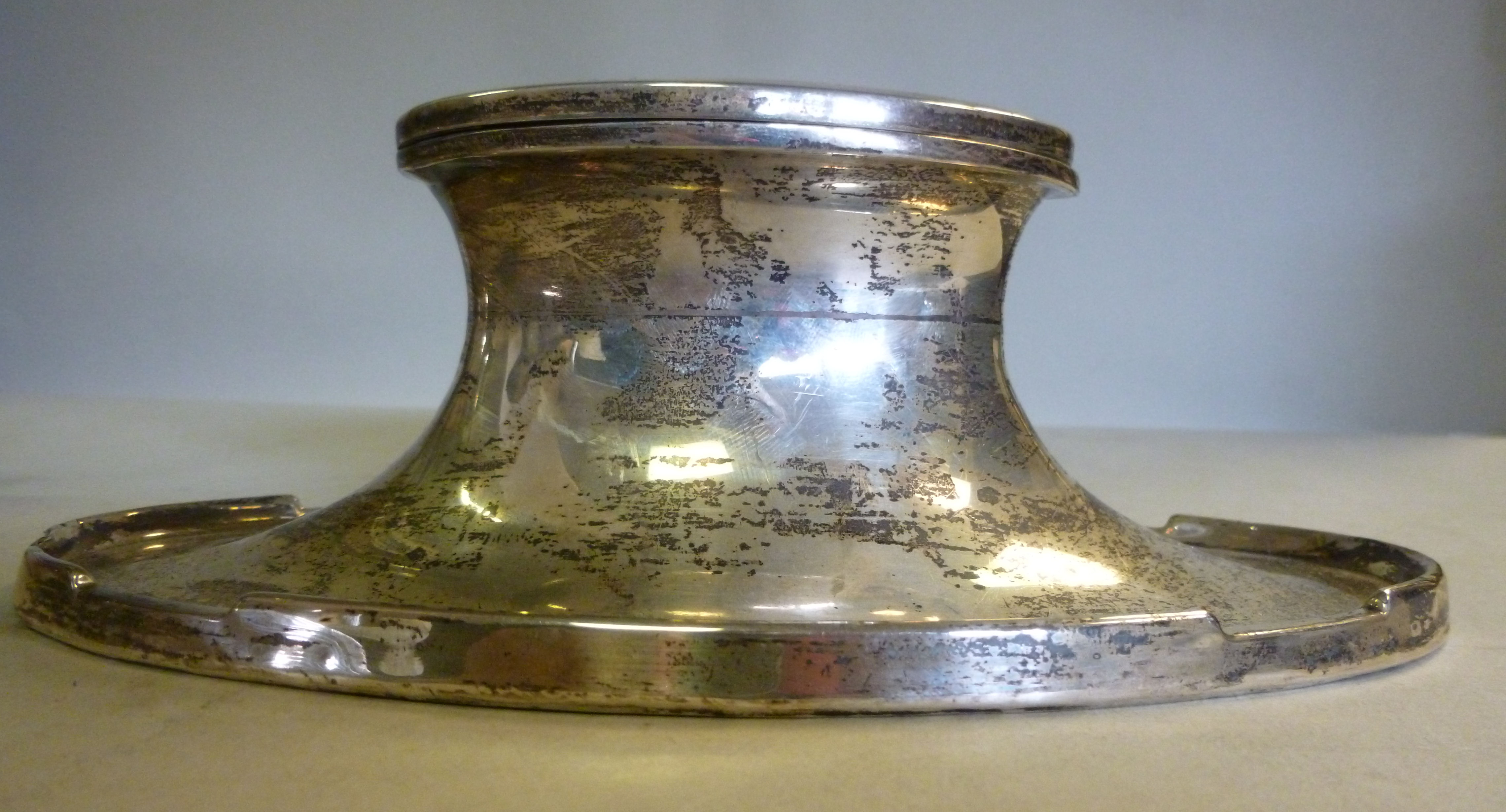 A silver capstan design oval inkwell, ha
