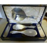 A five piece silver backed dressing tabl