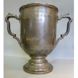 A silver trophy cup, having applied wire