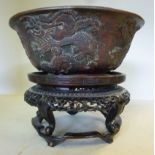 A mid 19thC Chinese bronze bowl, decorat