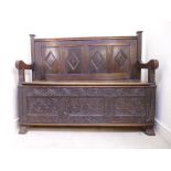 An 18thC and later oak settle, having a