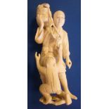 An early 20thC Japanese carved ivory fig