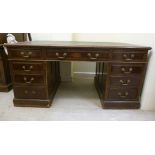 An early 20thC mahogany desk, having a t