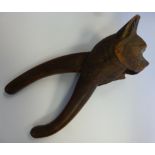 A pair of early 20thC carved wooden nove