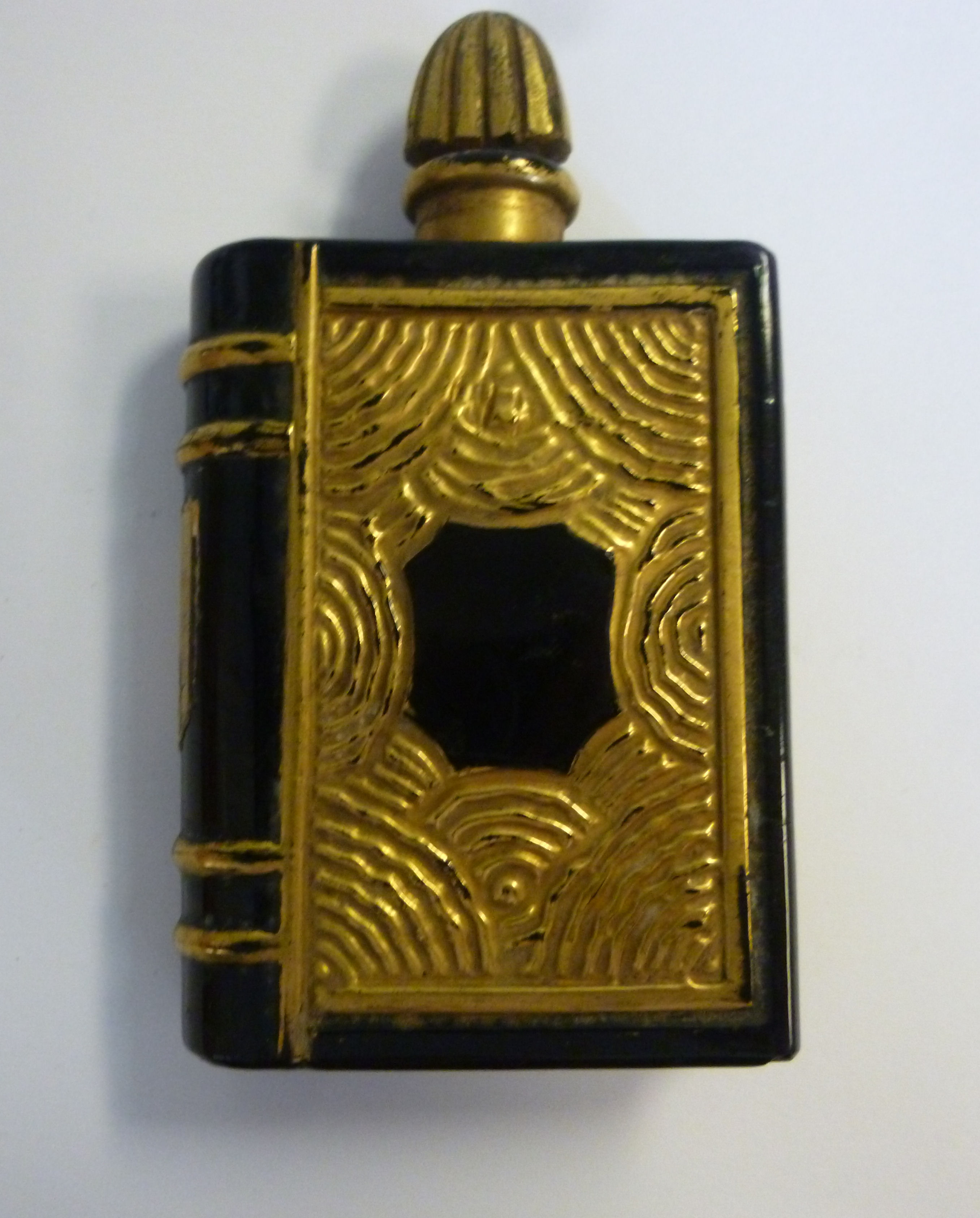 An early 20thC gilded, moulded opaque bl