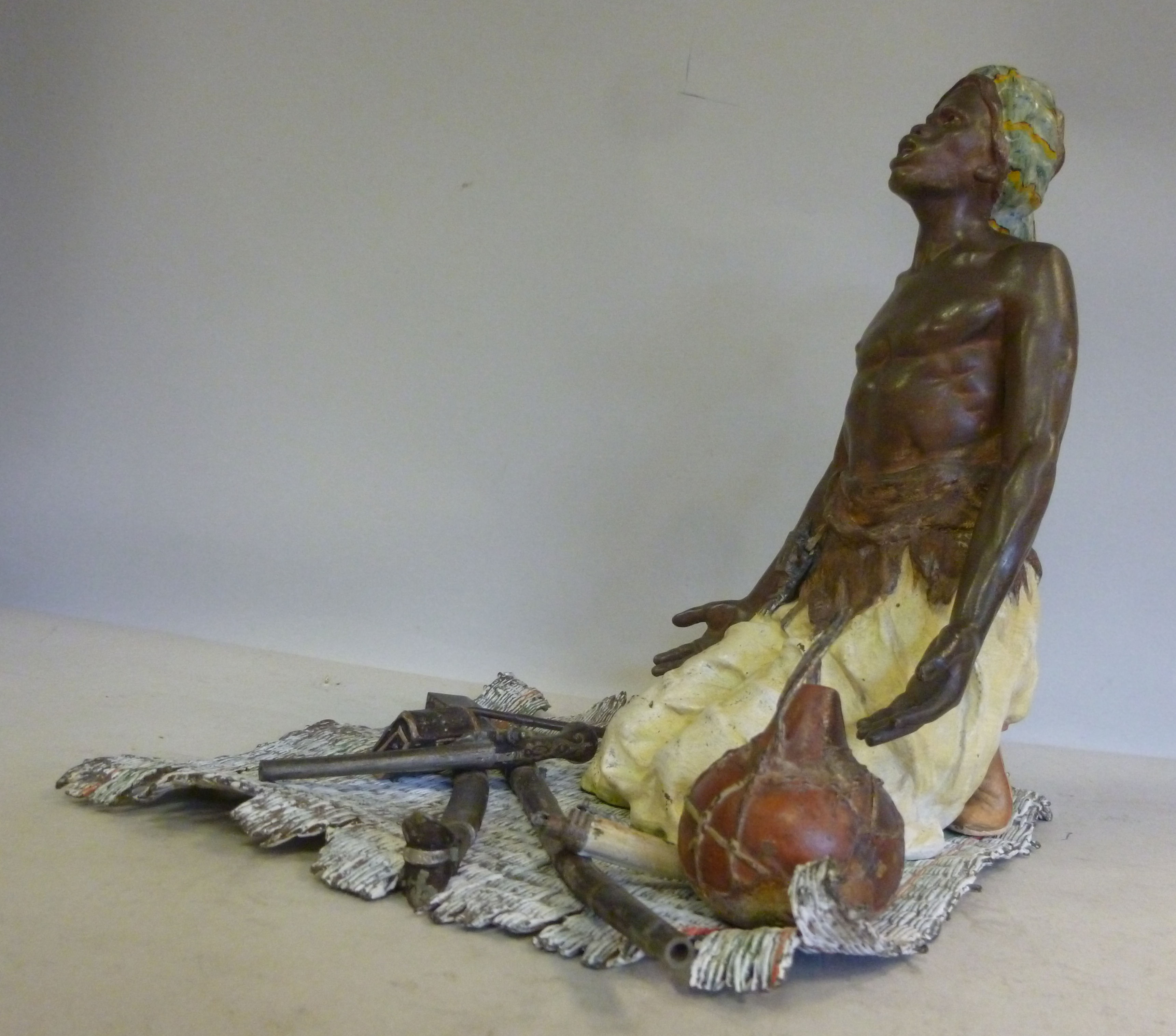 A Geschutzt Bergman cast and cold painted bronze figure, a Nubian kneeling on a rush mat, his arms - Image 4 of 8