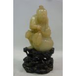 An early 20thC Chinese jade figure, a fi