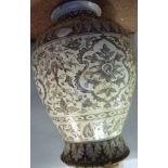 A 19thC pottery vase of ovoid form, havi