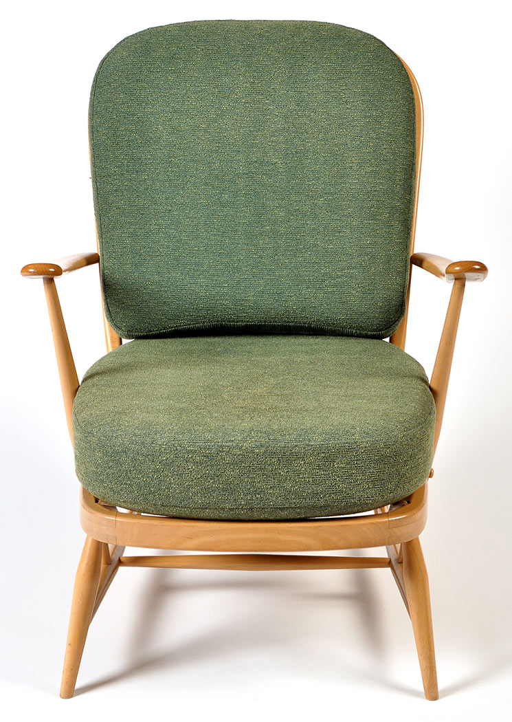 An Ercol beech wood framed easy armchair