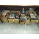 A large collection of paperback books, i