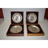 Five silver decorative plates, designed by Bernard Buffet, decorated with a rhino, giraffe, panda,