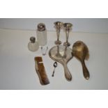 A silver backed dressing table set, items to include: a hand mirror, comb and hand brush; a cut