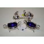 A pair of silver two-handled table salts with acanthus leaf handles and paw pattern feet; a silver