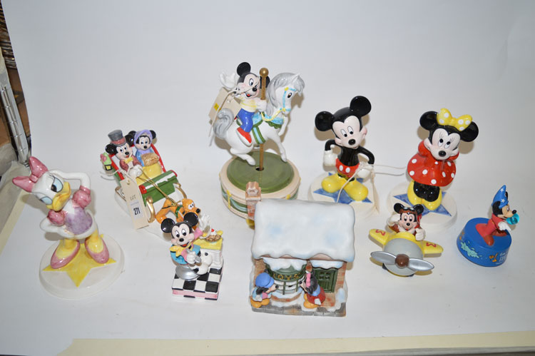 A collection of Schmid Disney figures of Mickey Mouse and characters, all boxed.