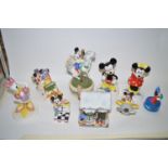 A collection of Schmid Disney figures of Mickey Mouse and characters, all boxed.