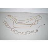 A silver fringed necklace of six rows of snake link chains; together with a modern hoop necklace,