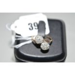 A diamond set double cluster ring,