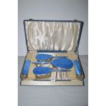 A silver and enamel back dressing table set, by Adie Bros.