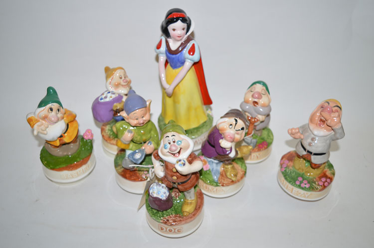 Porcelain topped music boxes from Disney's Snow White and the Seven Dwarfs, with boxes.