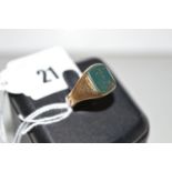 A bloodstone set signet ring, the blank matrix of rounded rectangular form, in 18ct.