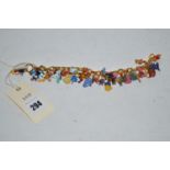 A Bradford Exchange enamelled metal charm bracelet, with various charms of Disney characters,