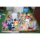 A large quantity of Disney copyright figurines, including: Mickey Mouse and others.