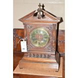 A 19th Century mantel clock in oak architectural style case,