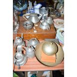 A cased part canteen of cutlery; a five-piece beaten pewter tea service;