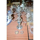 A pair of silver rimmed cut glass salts; a pair of two-branch silver plated candelabra;