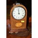 An Edwardian mantel clock in inlaid mahogany arched case.
