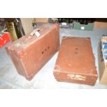 Two brown leather suitcases.