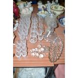 A quantity of cut glass brandy and wine glasses; bowls and glass stoppers.