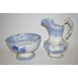 A 19th Century blue and white pottery jug; and a pedestal bowl.