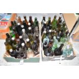 A collection of glass bottles, 19th Century and later, from Newcastle; etc., in two boxes.