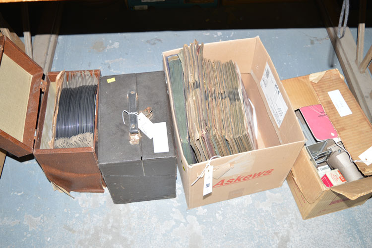 A 35mm slide and film strip projector; together with old vinyls,
