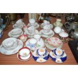 A French florally decorated tea service; a Crown Derby small plate and bowl;