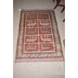 A Hunting Herathi rug decorated with ten panels of birds.