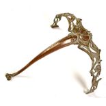 An early 20th Century Art Nouveau brass wall bracket, of scrolling design with central shell motif,