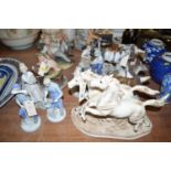 A collection of nine Continental figurines and horses.