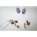 A pair of amethyst drop earrings; a pair of garnet earrings;