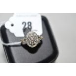 A diamond ring, the oval mount set slightly domed with diamonds throughout,