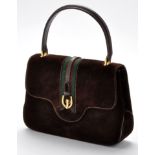 Gucci: a brown suede handbag,