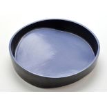 Attributed to Will Levi Marshall: a black and pale blue Studio pottery dish, with shaped base,