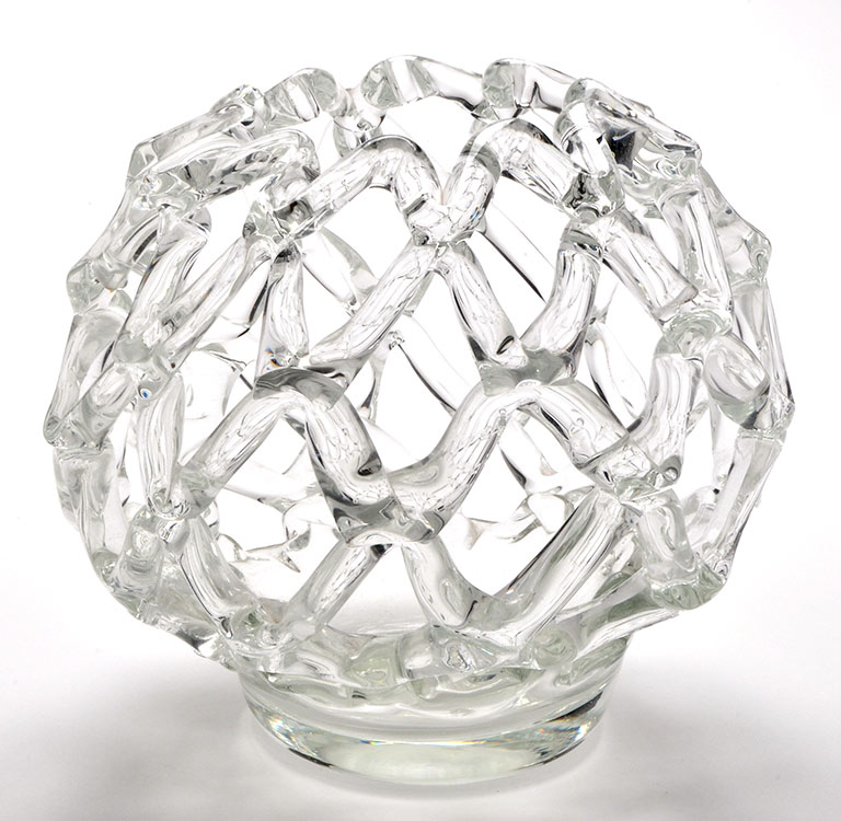 A clear openwork Studio glass vase, of circular form, 22cms. (8 1/2in.) high.