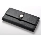 Hermes: black leather wallet with circular metal clasp and white stitching, 19cms. 7 1/5in. length.