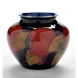 William Moorcroft: a small 'Pomegranate' ovoid vase, impressed factory mark to base 'Moorcroft,