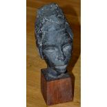 Artist Unknown: a cast lead female bust, on walnut base, 23cms (9in.) high.